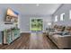 Comfortable living room with a plush reclining sofa, modern furnishings, and a view of the backyard at 1520 Jardine Loop, Little River, SC 29566