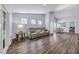 Bright and open living space with a reclining sofa, dining area, and plentiful natural light at 1520 Jardine Loop, Little River, SC 29566
