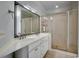 Bathroom with a double vanity, framed mirror, and glass enclosed shower at 1613 James Island Ave., North Myrtle Beach, SC 29582
