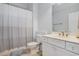 Bright bathroom featuring a modern vanity with ample counter space and a shower-tub combo at 1613 James Island Ave., North Myrtle Beach, SC 29582