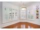 Bright dining area featuring hardwood floors, plantation shutters, and custom decorative trim at 1613 James Island Ave., North Myrtle Beach, SC 29582