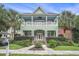 Two-story home with double porches, a well-maintained lawn, and lush landscaping at 1613 James Island Ave., North Myrtle Beach, SC 29582