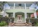 Charming two-story home with a welcoming front porch, manicured landscaping, and brick steps at 1613 James Island Ave., North Myrtle Beach, SC 29582