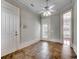 View of hallway featuring porcelain tile flooring, decorative trim, and two doors at 1613 James Island Ave., North Myrtle Beach, SC 29582