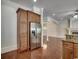 Spacious kitchen with stainless steel appliances and wood cabinets, open to the living area at 1613 James Island Ave., North Myrtle Beach, SC 29582