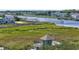 Breathtaking marsh view from the rooftop deck with a waterfront scene, docks, and a serene river at 1663 Harbor Dr., North Myrtle Beach, SC 29582