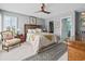Bright bedroom with en suite, ceiling fan, and plush carpeting at 1663 Harbor Dr., North Myrtle Beach, SC 29582