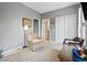 Cozy bedroom features a sitting chair, closet, and ensuite bathroom at 1663 Harbor Dr., North Myrtle Beach, SC 29582