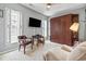 This bedroom offers a murphy bed, a flatscreen tv, and natural light at 1663 Harbor Dr., North Myrtle Beach, SC 29582
