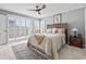 This bright bedroom features a ceiling fan, sitting area and balcony access at 1663 Harbor Dr., North Myrtle Beach, SC 29582