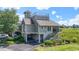 Beautiful two-story home with a rooftop deck, ground floor parking, and landscaped front yard at 1663 Harbor Dr., North Myrtle Beach, SC 29582