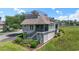 This lovely two-story home features lush landscaping, stylish stairs, and charming architectural details at 1663 Harbor Dr., North Myrtle Beach, SC 29582