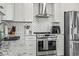 Modern kitchen featuring stainless steel appliances, stylish backsplash, granite counters, and a sink at 1663 Harbor Dr., North Myrtle Beach, SC 29582
