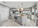 Bright kitchen features a center island with granite countertops and modern stainless steel appliances at 1663 Harbor Dr., North Myrtle Beach, SC 29582