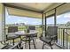 Covered screened in patio with table and chairs perfect for dining alfresco at 1663 Harbor Dr., North Myrtle Beach, SC 29582