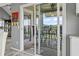 View of the patio with ceiling fan through the sliding glass doors at 1663 Harbor Dr., North Myrtle Beach, SC 29582