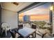 Balcony with a glass table, four chairs and a beautiful view of the beach at 2000 S Ocean Blvd. # V405, Myrtle Beach, SC 29577