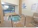 Indoor community hot tub area with windows at 2000 S Ocean Blvd. # V405, Myrtle Beach, SC 29577