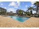 Tranquil pool with clear blue water, surrounded by lush palm trees and lounge seating at 2000 S Ocean Blvd. # V405, Myrtle Beach, SC 29577