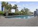 A view of the community swimming pool surrounded by lush landscaping at 2000 S Ocean Blvd. # V405, Myrtle Beach, SC 29577