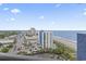Breathtaking aerial view of the city, beach, and ocean, showcasing the vibrant coastal scenery at 2001 S Ocean Blvd. # 1408, Myrtle Beach, SC 29577