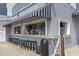 Outdoor bar featuring a striped awning, countertop, and a row of stools for guests to enjoy refreshments at 2001 S Ocean Blvd. # 1408, Myrtle Beach, SC 29577