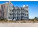 Exterior view from the beach, showcasing multiple balconies in an oceanfront hotel at 2001 S Ocean Blvd. # 1408, Myrtle Beach, SC 29577