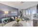 Open-concept living and dining area with seating for four and decorative accents at 2001 S Ocean Blvd. # 1408, Myrtle Beach, SC 29577