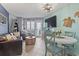Cozy living room with comfortable seating, television, and dining table perfect for relaxing and entertaining at 2001 S Ocean Blvd. # 1408, Myrtle Beach, SC 29577