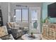 Comfortable sitting area with cushioned chairs and access to outdoor balcony at 2001 S Ocean Blvd. # 1408, Myrtle Beach, SC 29577