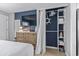Bedroom includes a dresser, closet with an open storage system, and modern decor at 2001 S Ocean Blvd. # 1408, Myrtle Beach, SC 29577