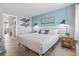 Bright bedroom featuring nautical decor, bedside tables, and tiled floors for a serene retreat at 2001 S Ocean Blvd. # 1408, Myrtle Beach, SC 29577