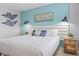 Inviting bedroom features a white headboard, nautical-themed decor, and stylish wall lighting at 2001 S Ocean Blvd. # 1408, Myrtle Beach, SC 29577