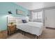 Well-lit bedroom offers a comfortable bed, stylish nightstand, and window with blinds for privacy at 2001 S Ocean Blvd. # 1408, Myrtle Beach, SC 29577
