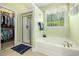 Bright bathroom with a glass enclosed shower, bathtub, and walk-in closet at 2010 Chattooga Ct., Myrtle Beach, SC 29588