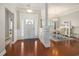Elegant foyer with hardwood floors leading into the dining area with wainscotting at 2010 Chattooga Ct., Myrtle Beach, SC 29588