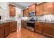 Well-equipped kitchen featuring stainless steel appliances, granite countertops, and hardwood floors at 2010 Chattooga Ct., Myrtle Beach, SC 29588