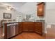 Open concept kitchen features granite countertops, hardwood floors, and stainless steel dishwasher at 2010 Chattooga Ct., Myrtle Beach, SC 29588