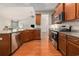 Well-equipped kitchen with stainless steel appliances, granite countertops, and hardwood floors at 2010 Chattooga Ct., Myrtle Beach, SC 29588