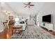 Bright living room with hardwood floors, a ceiling fan, and comfortable seating arrangement at 2010 Chattooga Ct., Myrtle Beach, SC 29588