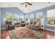 Bright sunroom with vaulted ceiling and many windows, creating a cozy and inviting space at 2010 Chattooga Ct., Myrtle Beach, SC 29588