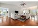 Cozy living room with hardwood floors and open-concept design to the dining area at 2010 Chattooga Ct., Myrtle Beach, SC 29588