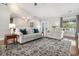 Open-concept living room featuring hardwood floors, neutral decor, and lots of natural light at 2010 Chattooga Ct., Myrtle Beach, SC 29588