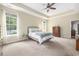 Large, bright bedroom with a tray ceiling, two windows, and wood furniture at 2010 Chattooga Ct., Myrtle Beach, SC 29588