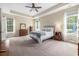 Large bedroom with two windows, dresser, carpet, and a ceiling fan at 2010 Chattooga Ct., Myrtle Beach, SC 29588