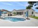 Backyard with inground pool, patio, seating area, screened in porch, and grill at 2010 Chattooga Ct., Myrtle Beach, SC 29588