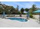 Backyard with inground pool, patio, seating area, umbrellas, and white vinyl privacy fence at 2010 Chattooga Ct., Myrtle Beach, SC 29588