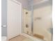 Bright bathroom featuring a shower, closet and tile flooring at 2060 Cross Gate Blvd. # 102, Surfside Beach, SC 29575