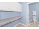 Bathroom with toilet and sink with storage and blue walls at 2060 Cross Gate Blvd. # 102, Surfside Beach, SC 29575
