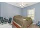 Inviting bedroom featuring light blue walls, plush carpeting, and an organized work-from-home space at 2060 Cross Gate Blvd. # 102, Surfside Beach, SC 29575